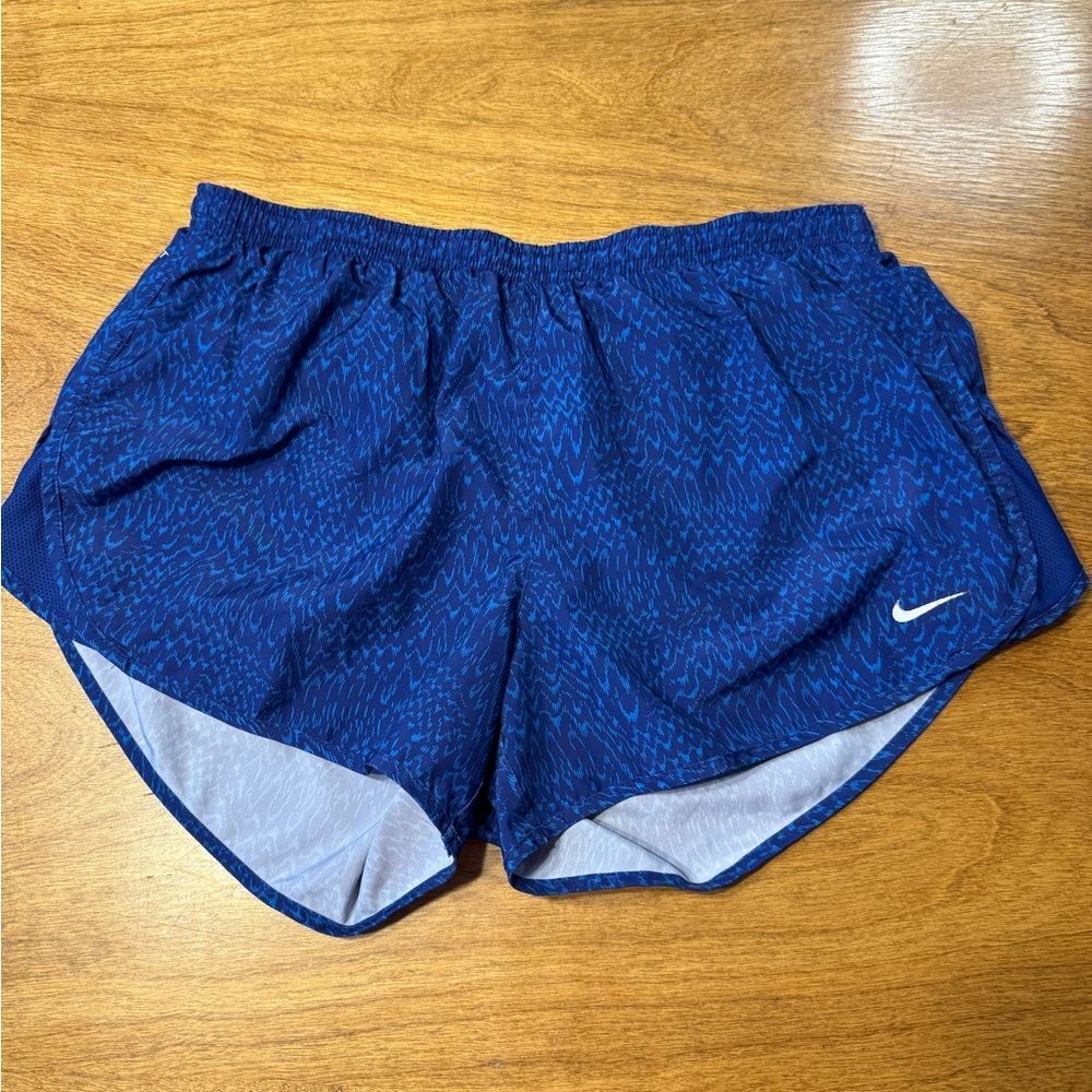 Nike Women's Blue Athletic Running Shorts with White Swoosh.